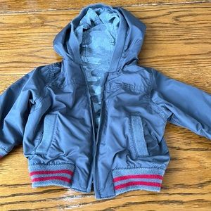 Reversible infant gray windbreaker jacket.  Size 12-18 months.  Dino print.
